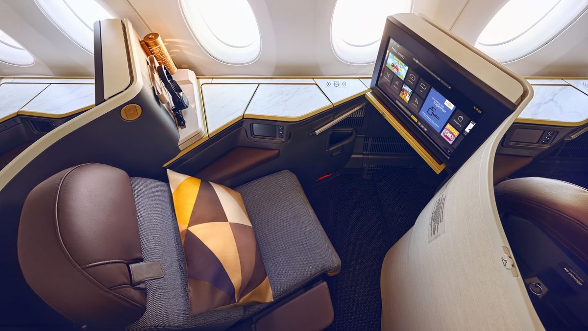 how to get free upgrade to business class etihad